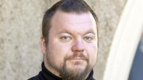 Jarmo Kallunki Headshot in front of building
