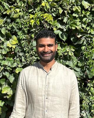 Rajkamal Singh Headshot in front of greenery