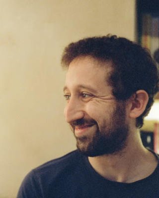 Headshot of Michael Zanger-Tishler looking to the side.