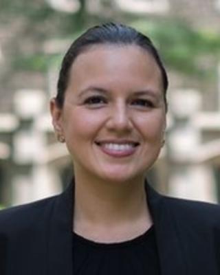 Headshot of Sandra Portocarrero standing outside and smiling