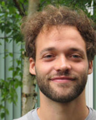 Thomas_Kurer_standing outside_smiling