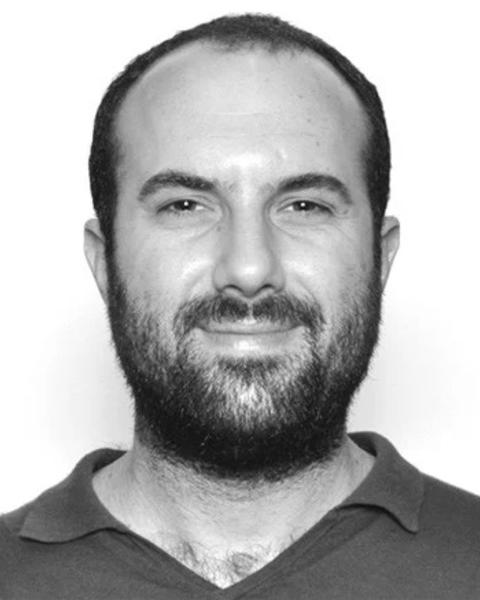 Black and white headshot of Guy Priver in front of a white background