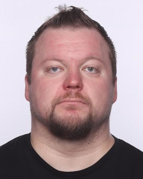 Headshot of Jarmo Kallunki in front of a light purple background