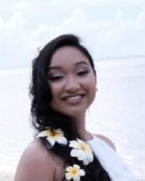 Headshot of Chelsea King in front of a blurred body of water