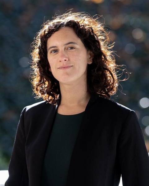 Headshot of Elena Ayala Hurtado in front of a blurred background
