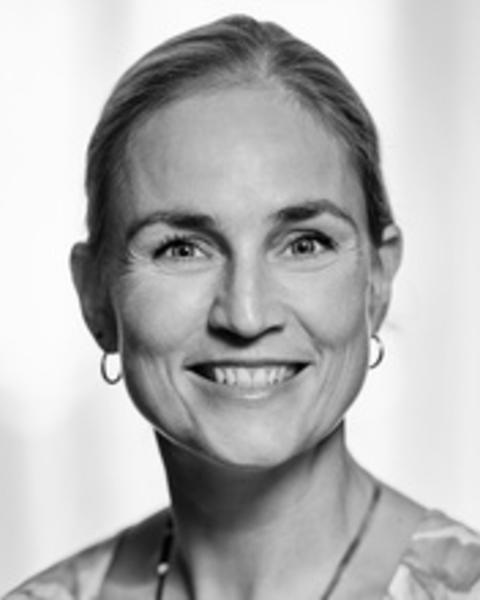Headshot of Sabina Pultz situated against a blurred background