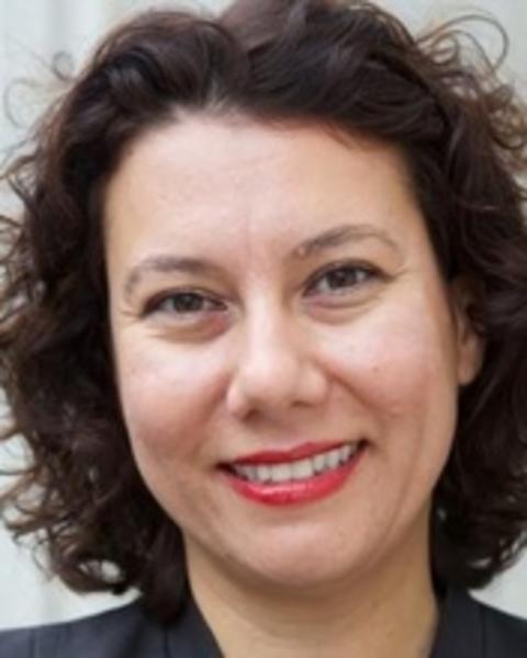Headshot of Gokce Yurdakul set against a blurred background