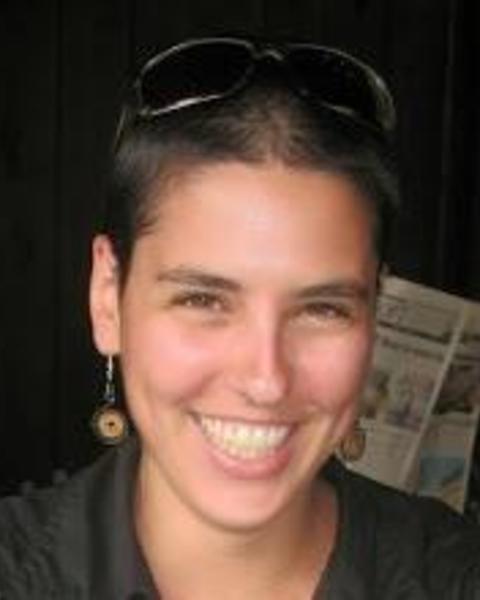 Headshot of Yael Rimer-Cohen set against a blurred background