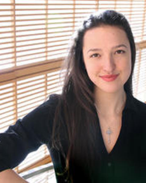 nina_gheihman_standing_on_wcfia_stairs_smiling