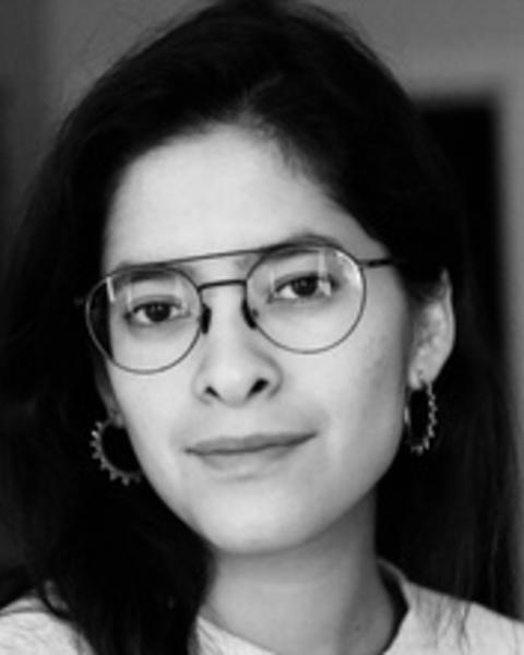 Headshot of Melissa Hernández Jasso in front of a blurred background