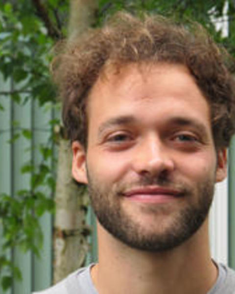 Thomas_Kurer_standing outside_smiling