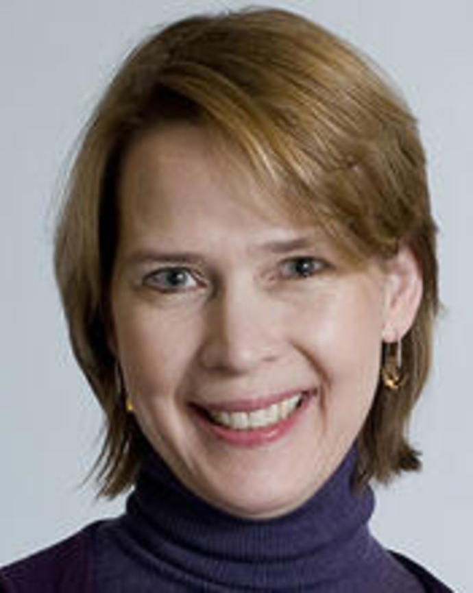Headshot of Anne Becker against a grey backdrop