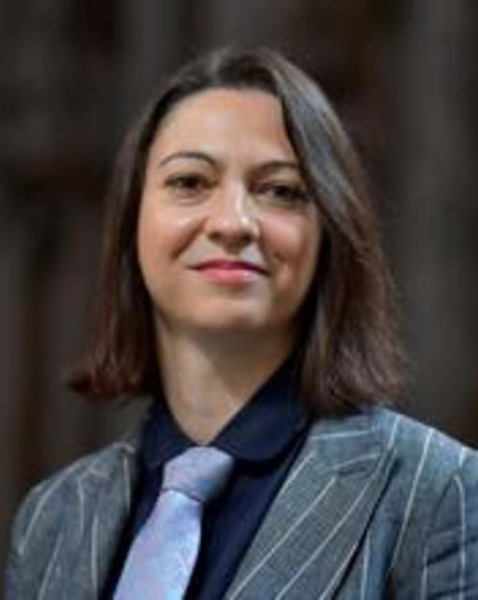 Headshot of Lorenza Antonucci standing in front of a blurred background