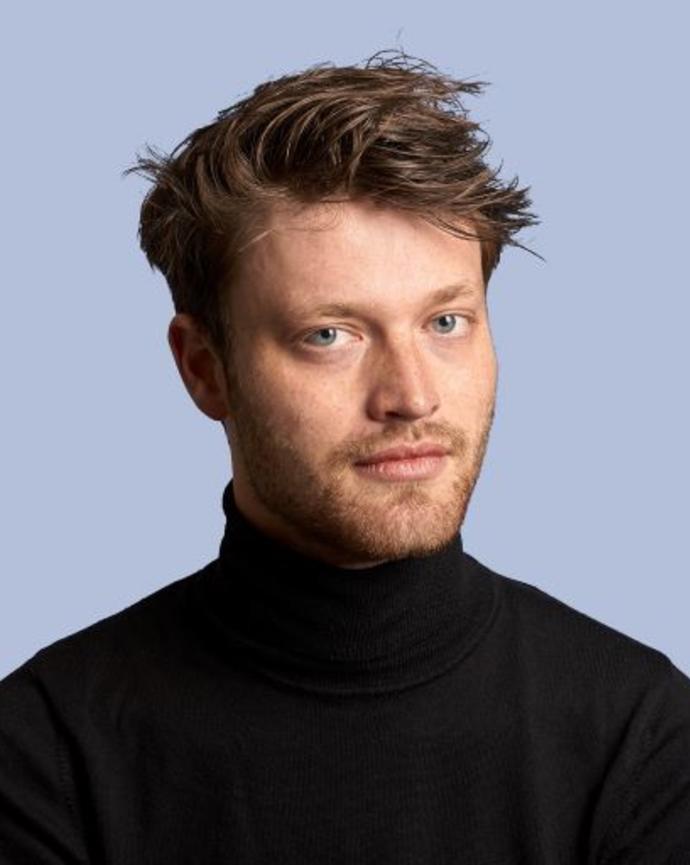 Headshot of Luuc Brans against a light blue background