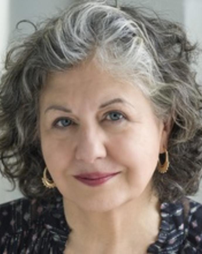 Headshot of Michele Lamont in front of a grey background