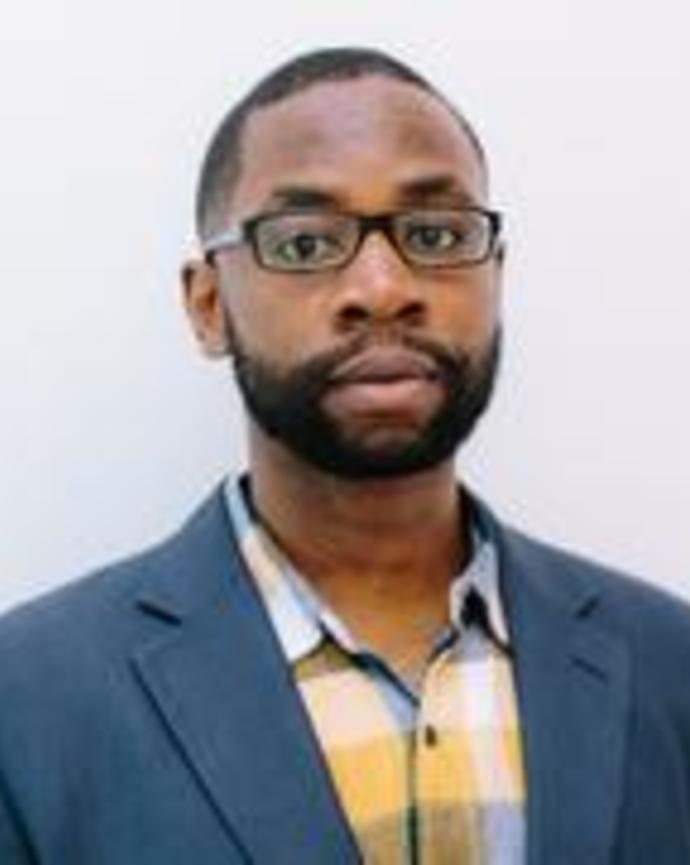 Headshot of Wendell Adjetey in front of a light grey background