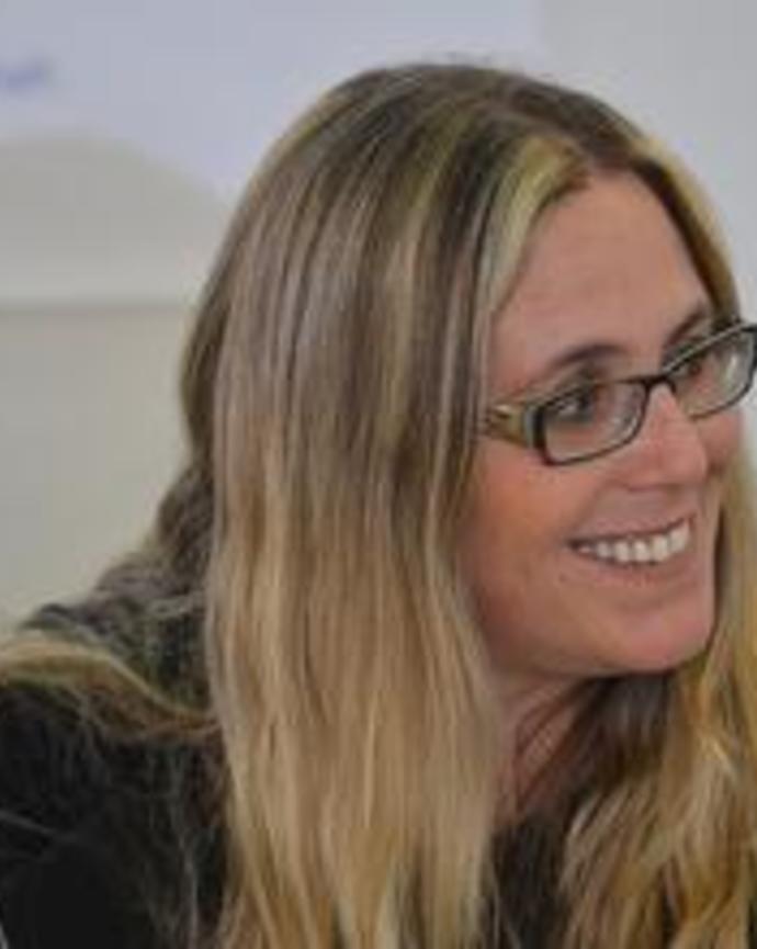Headshot of Yael Berda sitting at book launch smiling