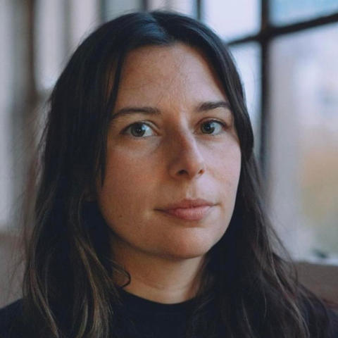 Laura Tanguay Headshot in front of a window