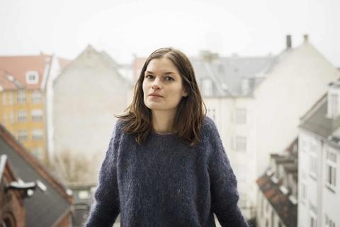 kristina_bakkaer_simonsen_standing_outside_in_a_city